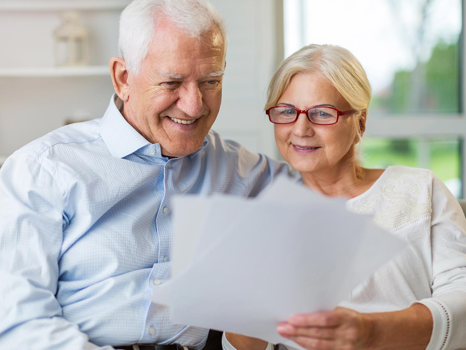 An older couple going over documents.