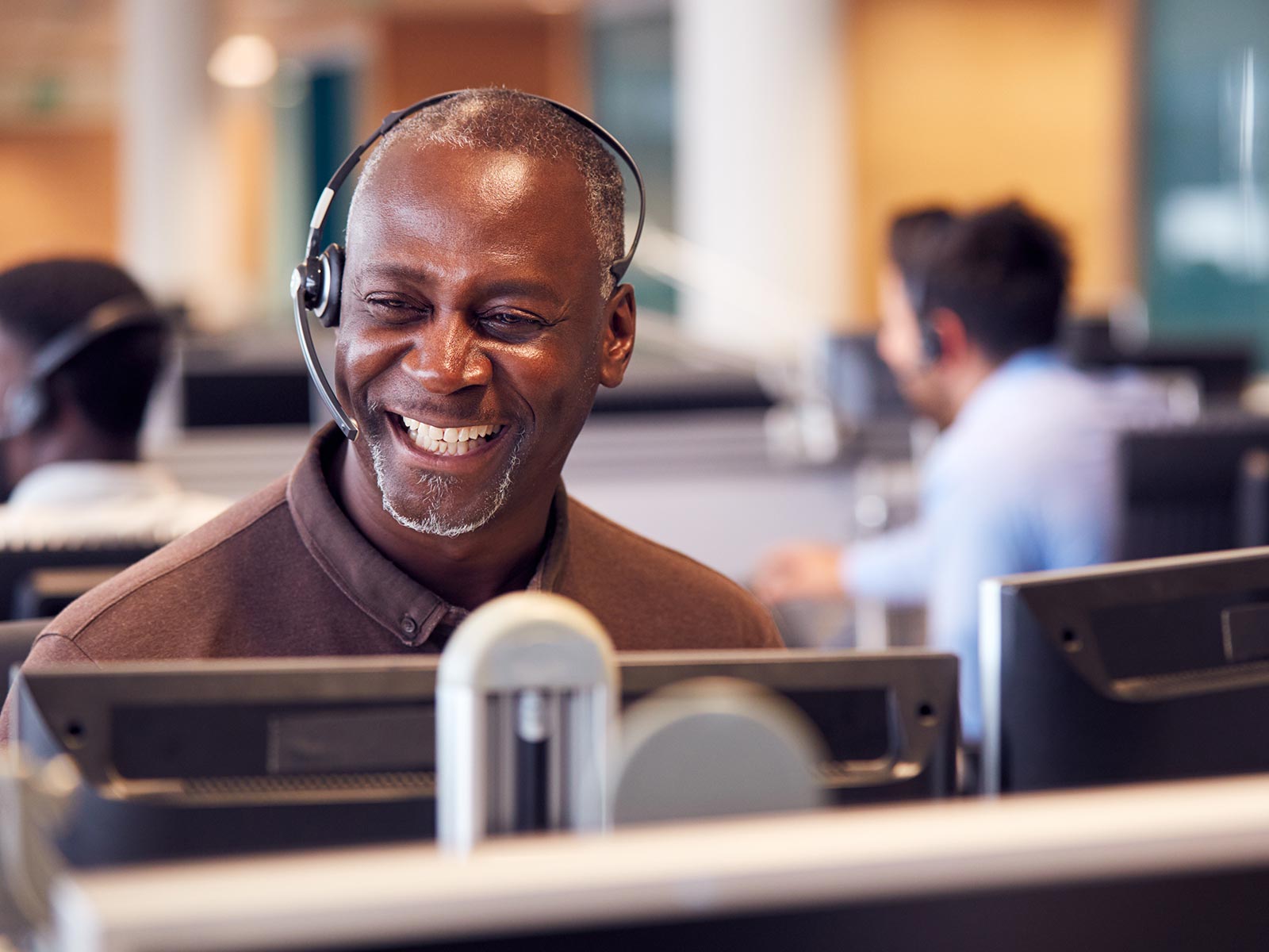 A customer services representative smiling