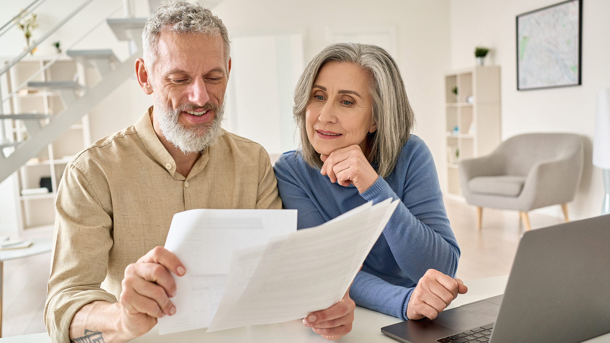 Couple consults together over paperwork