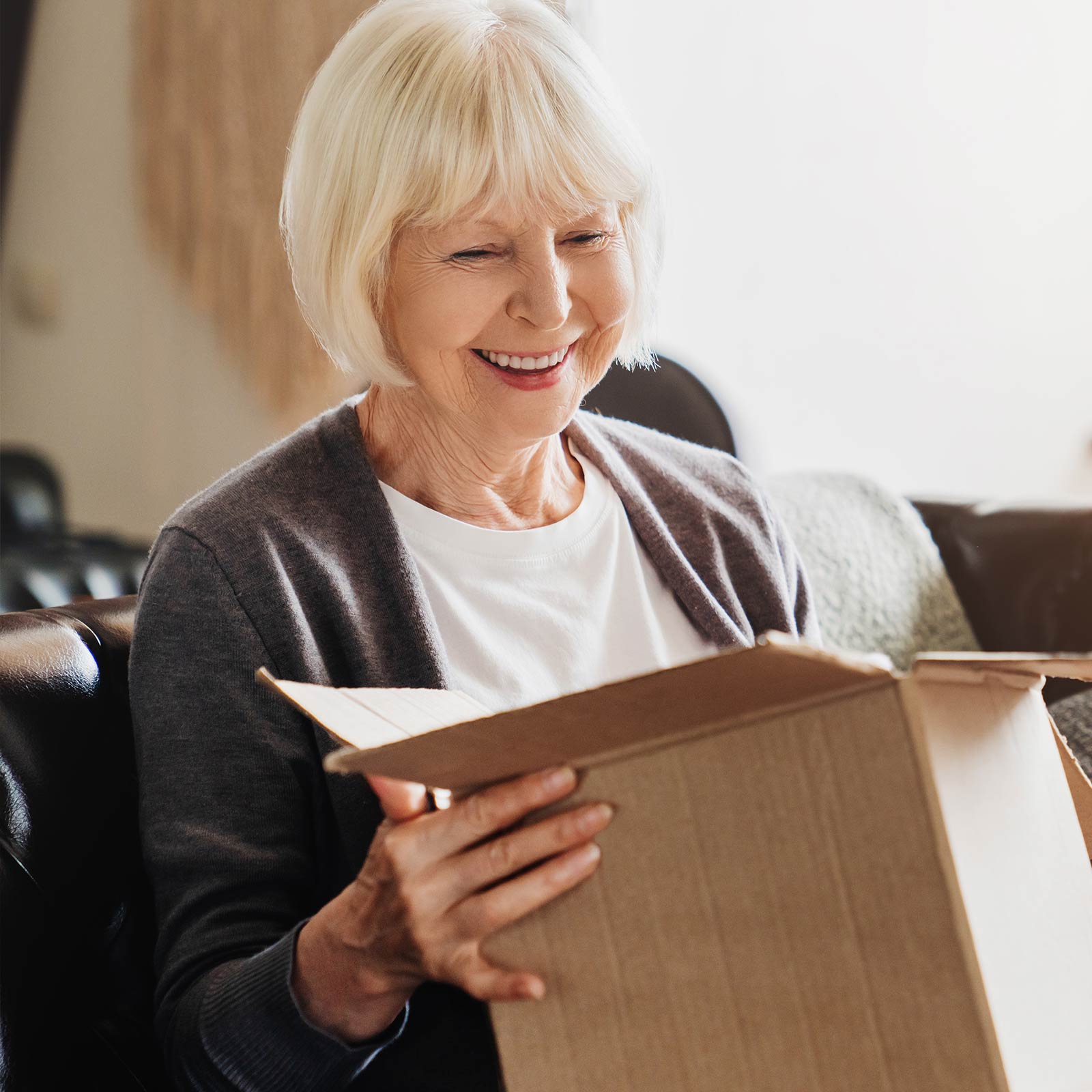 Older woman going through a package.