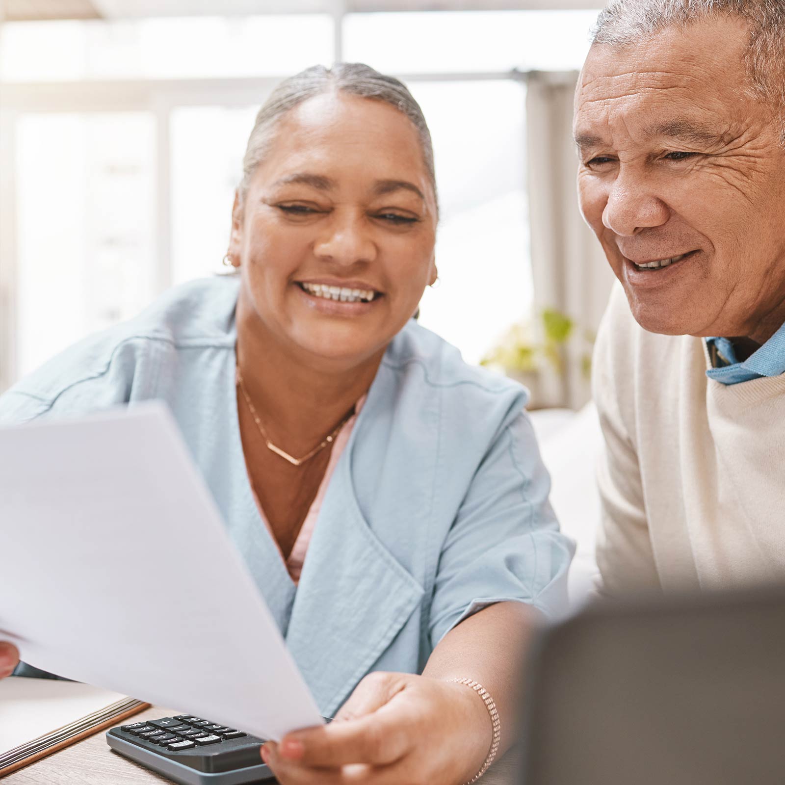 Older couple going over member forms.