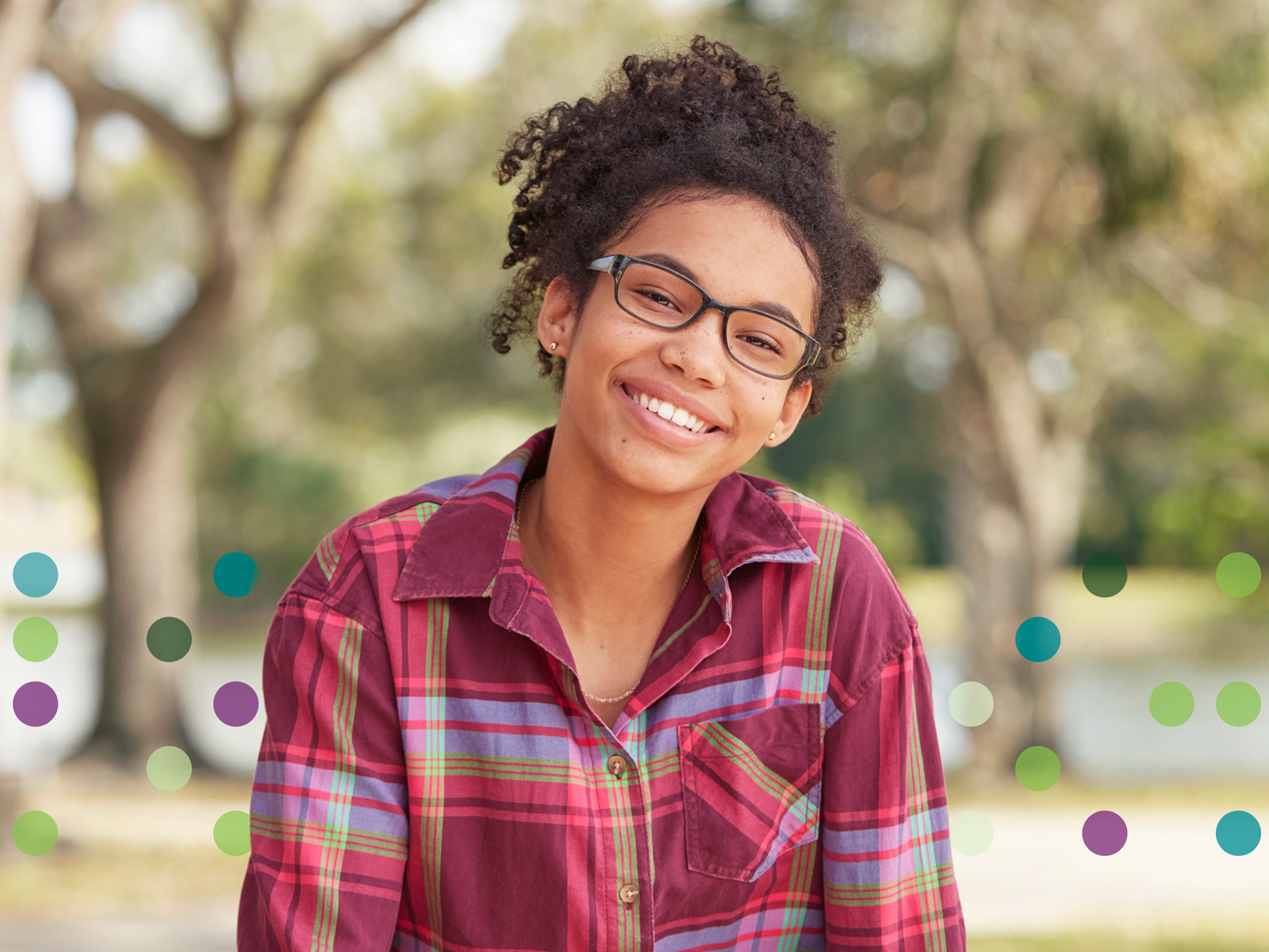 Person wearing glasses and smiling